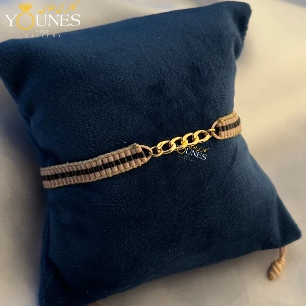 دستبند میوکی کرم خط مشکی کارتیر طلا